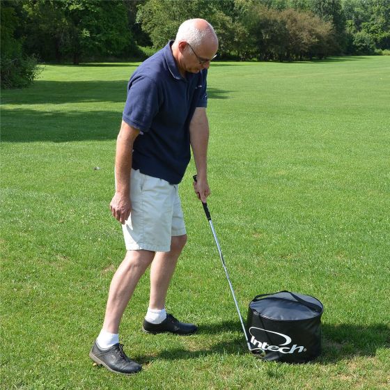 player hitting a club against the Intech Golf Impact Bag