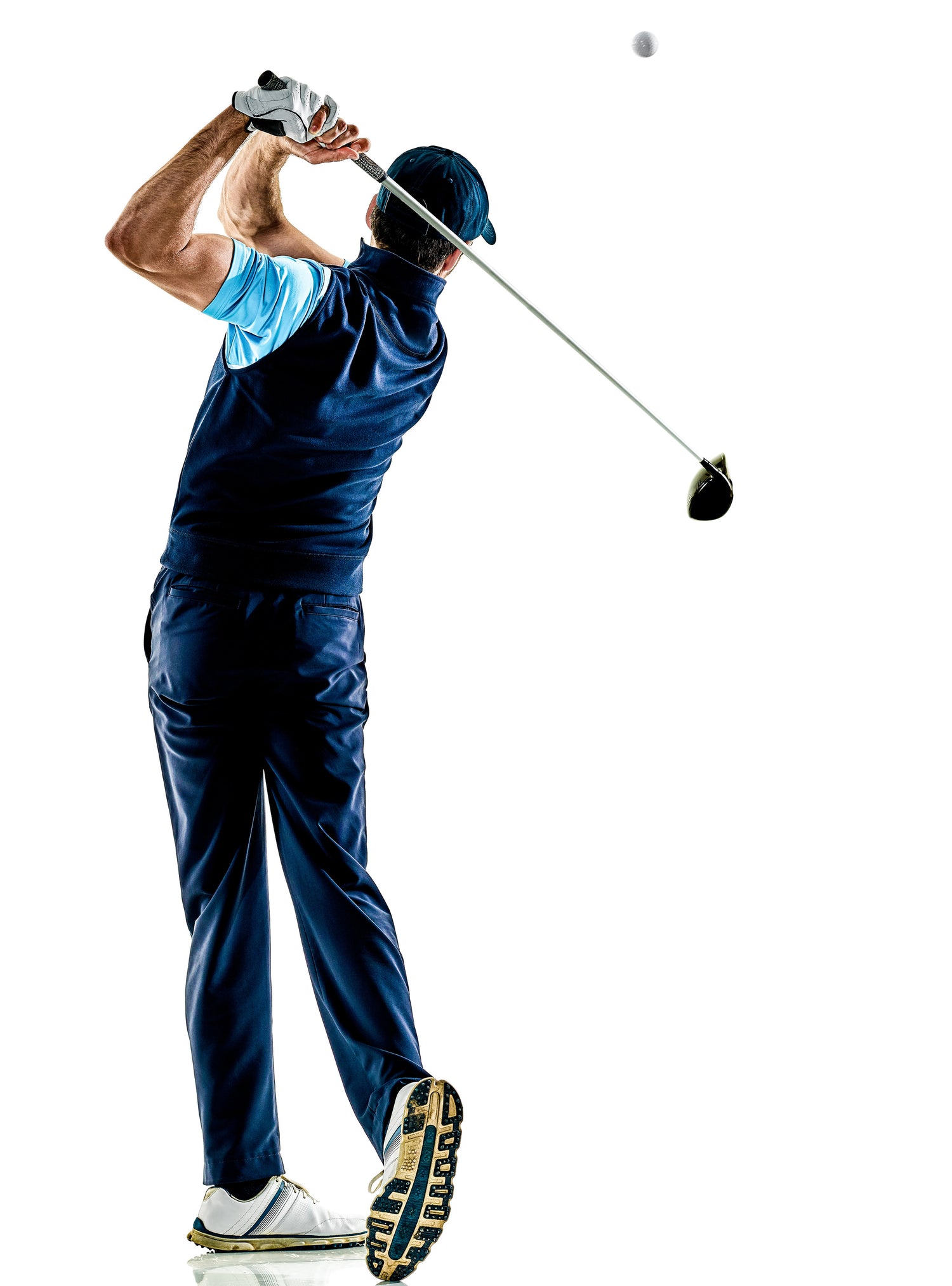 Golfer watching ball in flight